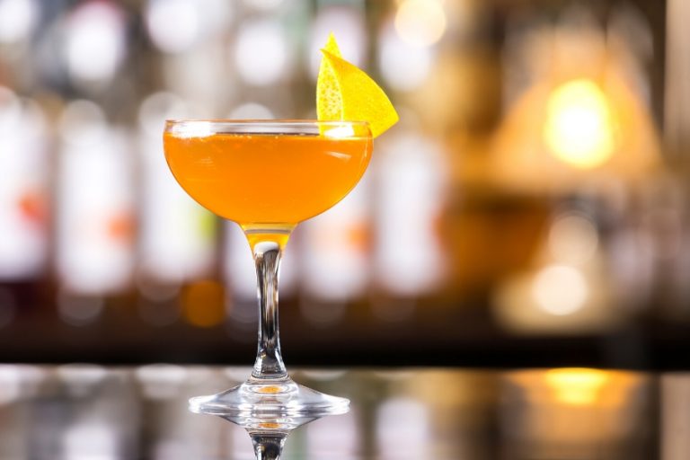 Citrus orange cocktail with lemon twist