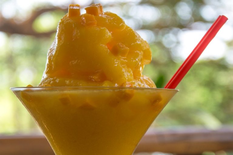 A heaped glass of frozen mango daiquiri