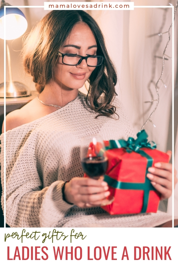 lady holding christmas gift and glass of wine