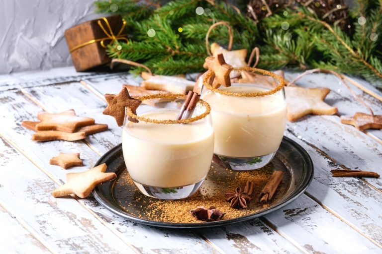 Two glasses of traditional eggnig with cinnamon