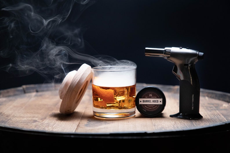 etsy cocktail smoking gun with a steaming glass of liquor