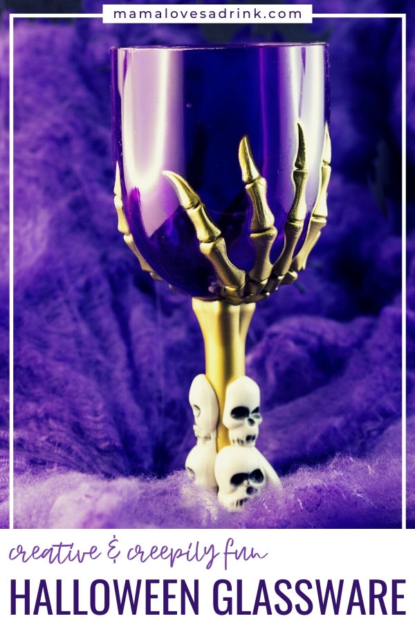 Wine glass being held by a metal skeleton hand - best halloween glassware